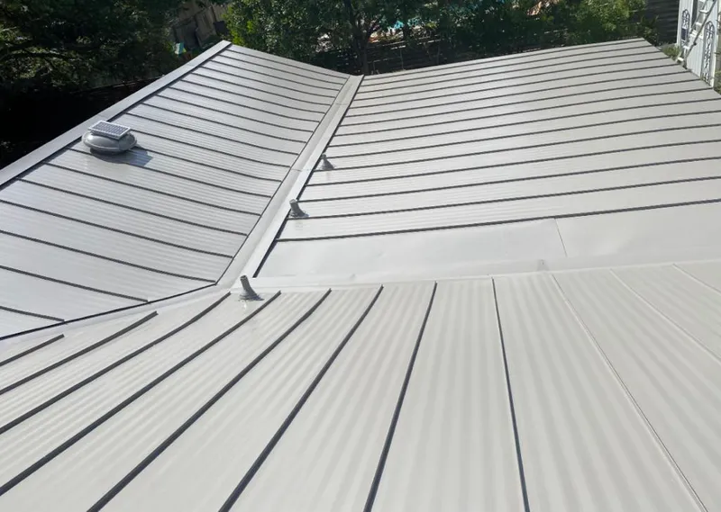 Solar attic fan installed on a metal roof for Roof Ventilation in Mount Carmel